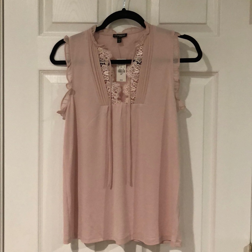 Pink/blush top with a v-neck lace.